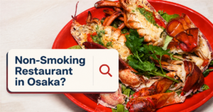 赤い皿に盛り付けられた活オマール海老の写真と「Non-Smoking Restaurant in Osaka?」の文字