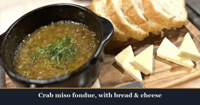 Crab miso fondue in a black pot with sliced bread and cheese on a wooden board at Kaiebi, a 6-seat seafood counter in Shinsaibashi, Osaka