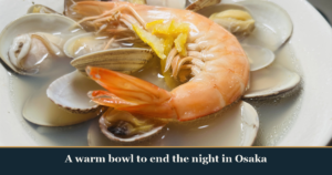 A bowl of shellfish-broth ramen soup with clams and a whole prawn, Grand Shellfish Symphony, a shime dish at Kaiebi, a 6-seat seafood counter in Shinsaibashi, Osaka